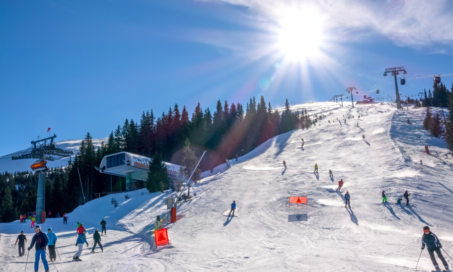 slovakia-winter-ski-resort-jasna-bright-sun-blue-sky-ski-slope-ski-lifts-many-skiers